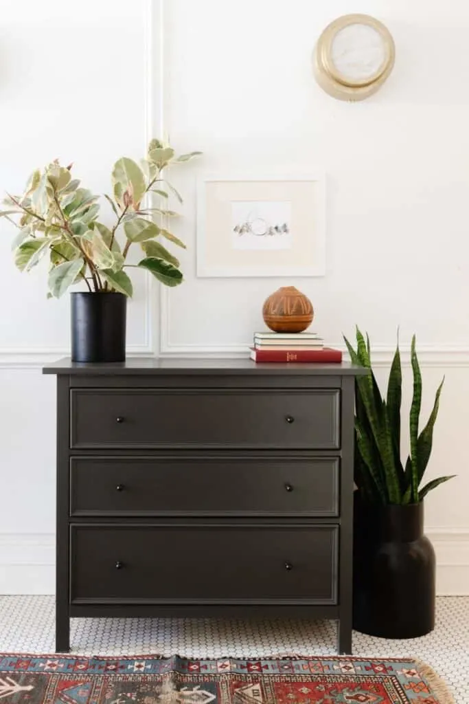 Urbane Bronze used on a dresser against whtie walls and sitting on white penny tile floors.