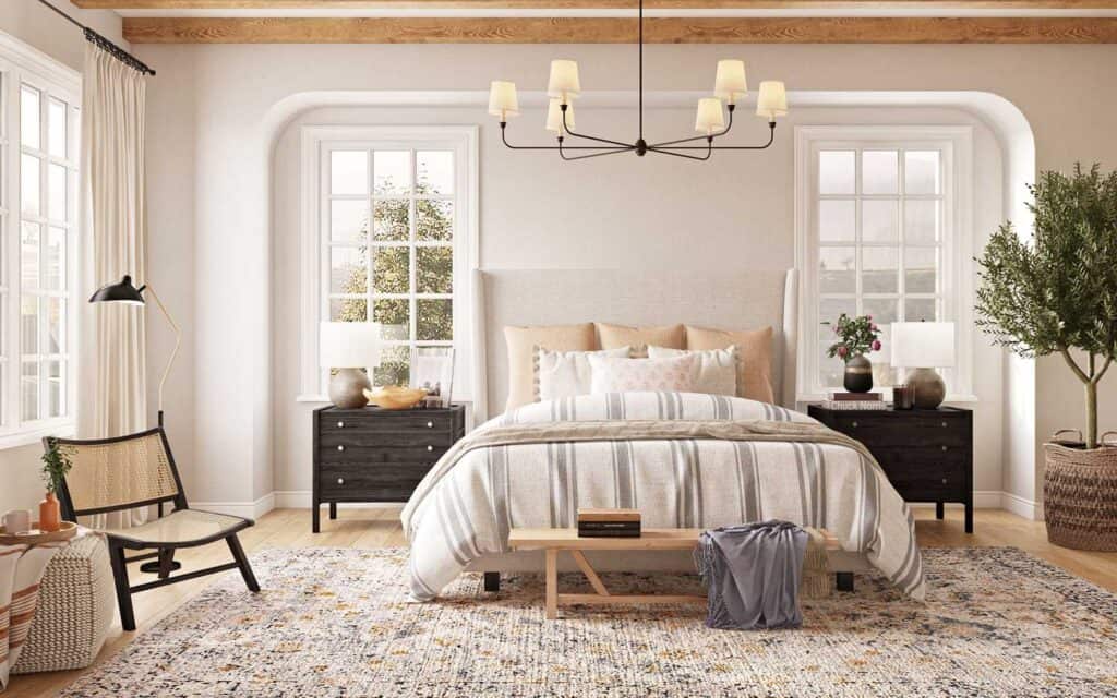 A bedroom with Balboa Mist on the walls, light wood toned beams, a black chandelier over the bed and light hardwood floors.