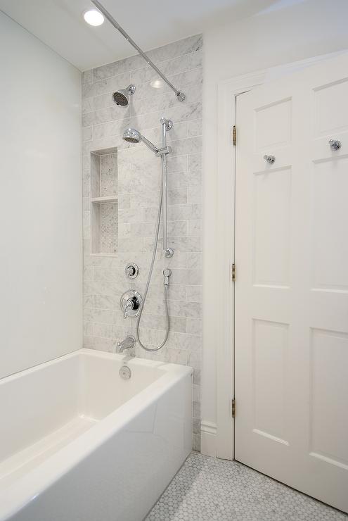 Cloud White used in a bathroom with lots of marble tile and silver fixtures.
