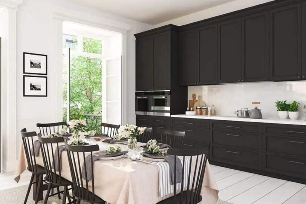 Black cabinets with white counters and backsplash.