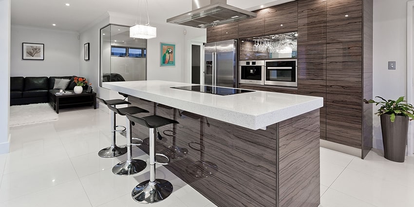 Modern gray cabinets with a horizontal wood grain and white sintered stone countertops.