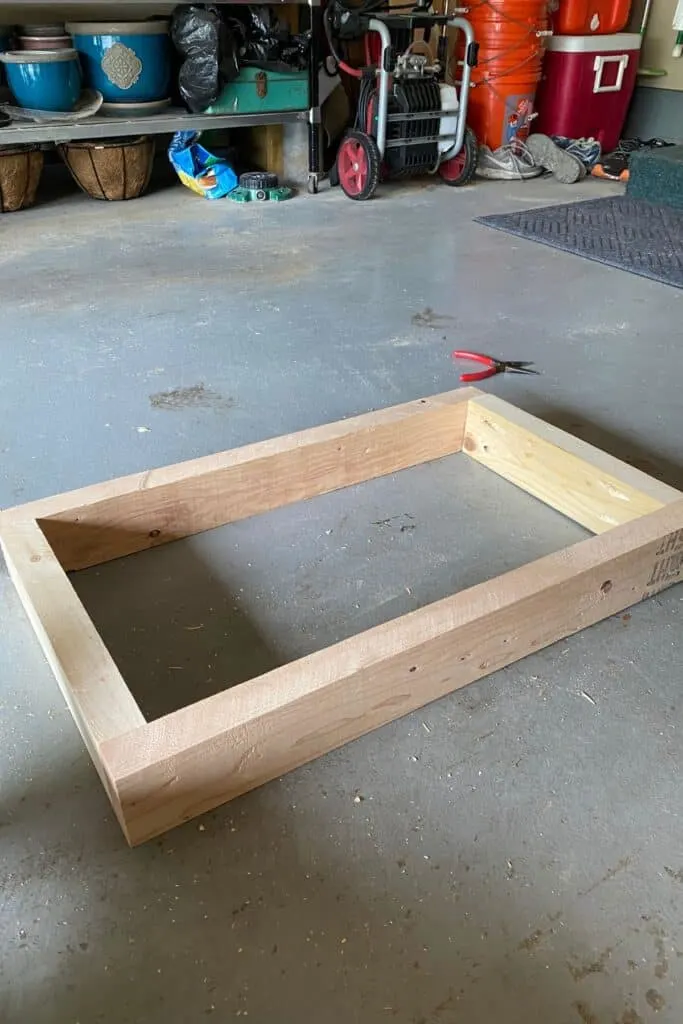 two by fours screwed together with Kreg Jig into a rectangle.