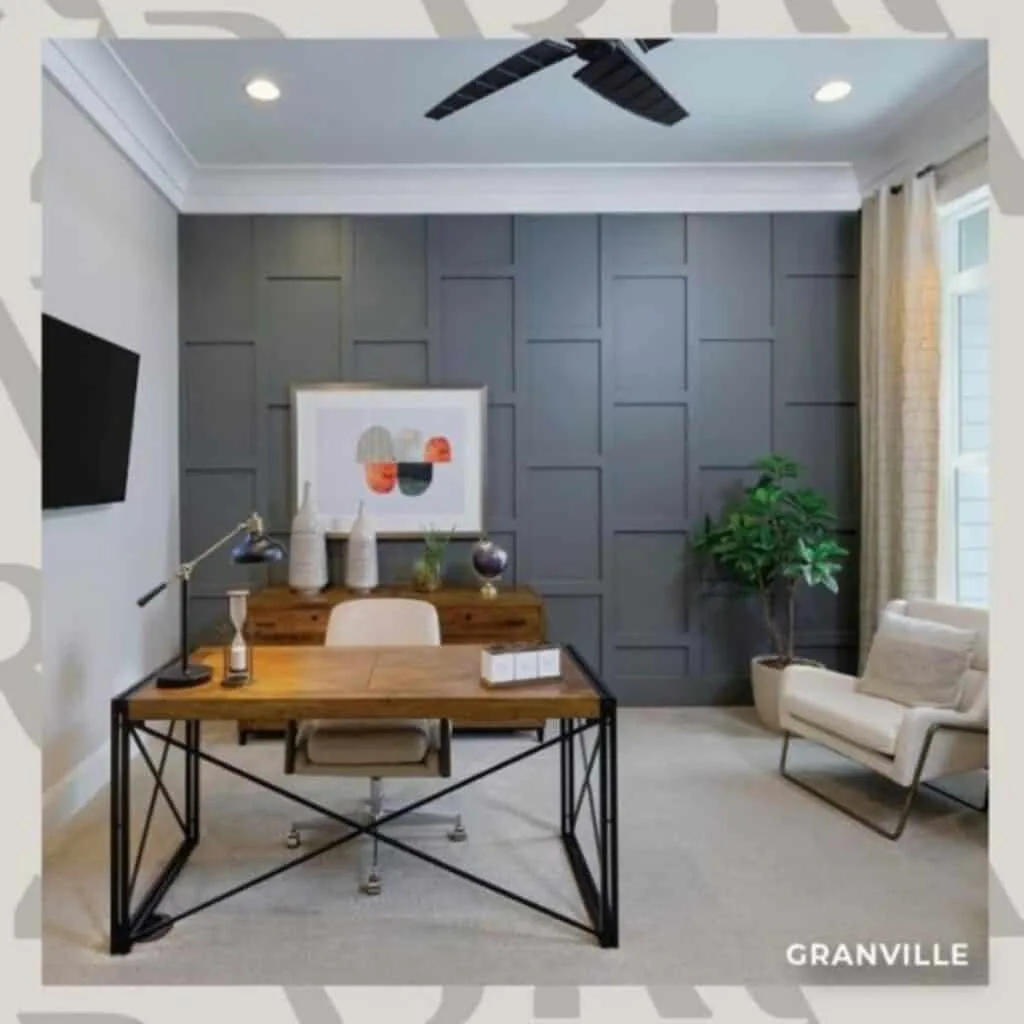 An office with an accent wall painted in grizzle gray.