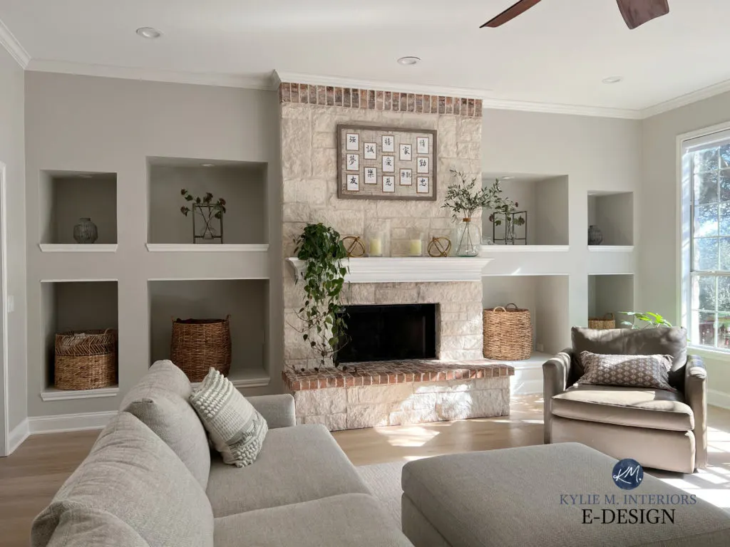 A family room with a beige stone fireplace and light hardwood floors with Crushed Ice on the walls.