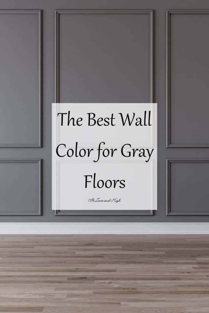 A room with gray wood floors, dark gray walls with picture molding and white trim with text overlay.