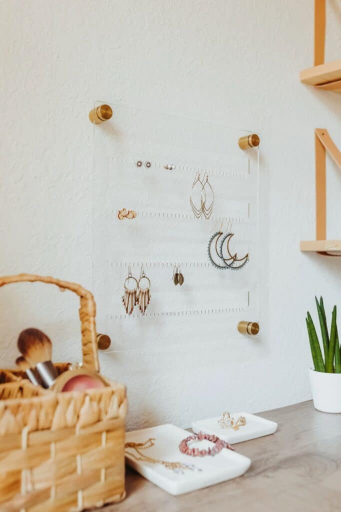 An acrylic wall mounted jewelry holder for earrings.