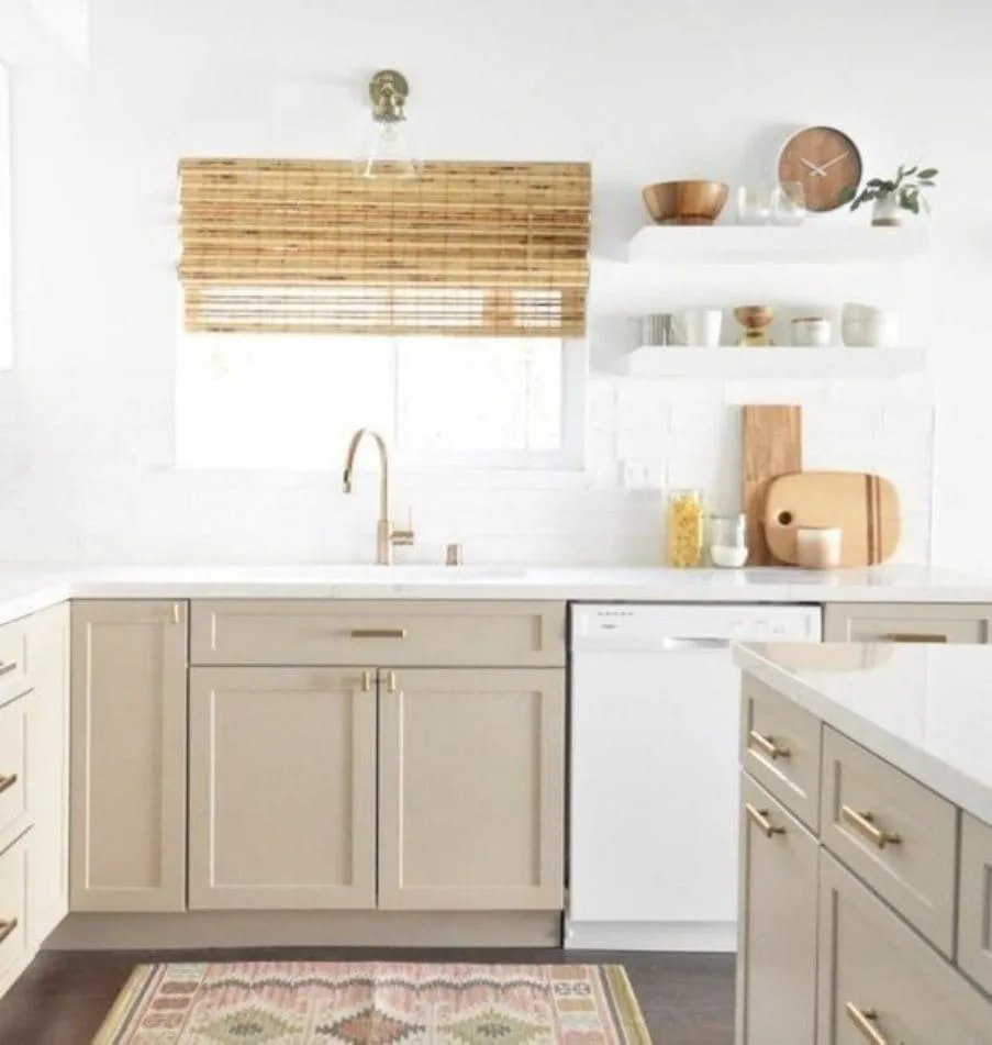Natural Linen on cabinets with gold hardware, white counters and a white subway tile backsplash.