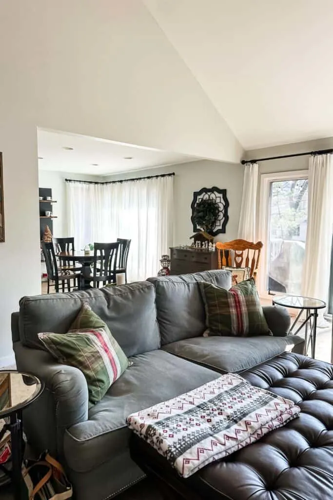 The family room with green and red plaid throw pillows.