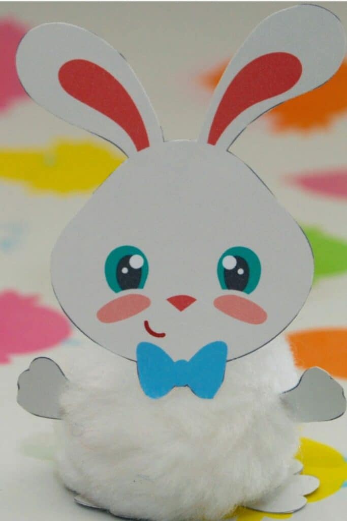 A bunny craft with paper and pom poms.