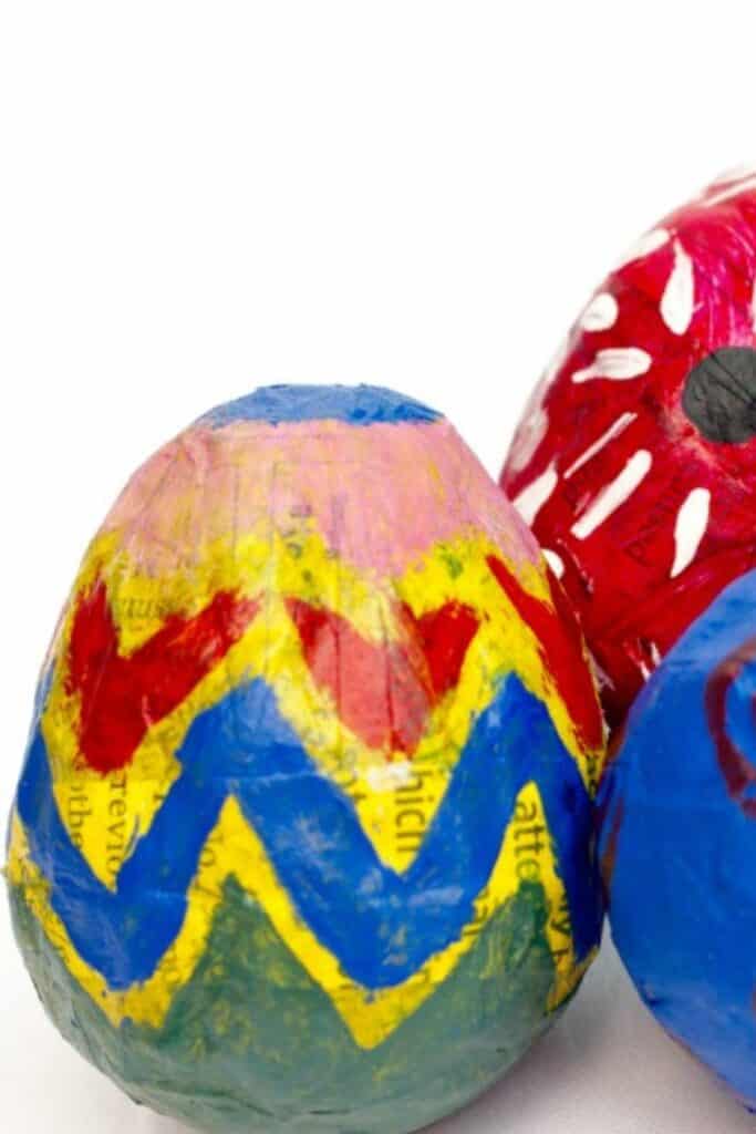 Paper Mache eggs painted in different colors.