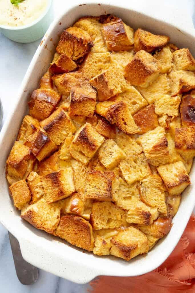 A french toast casserole in a white 13x9 pan 