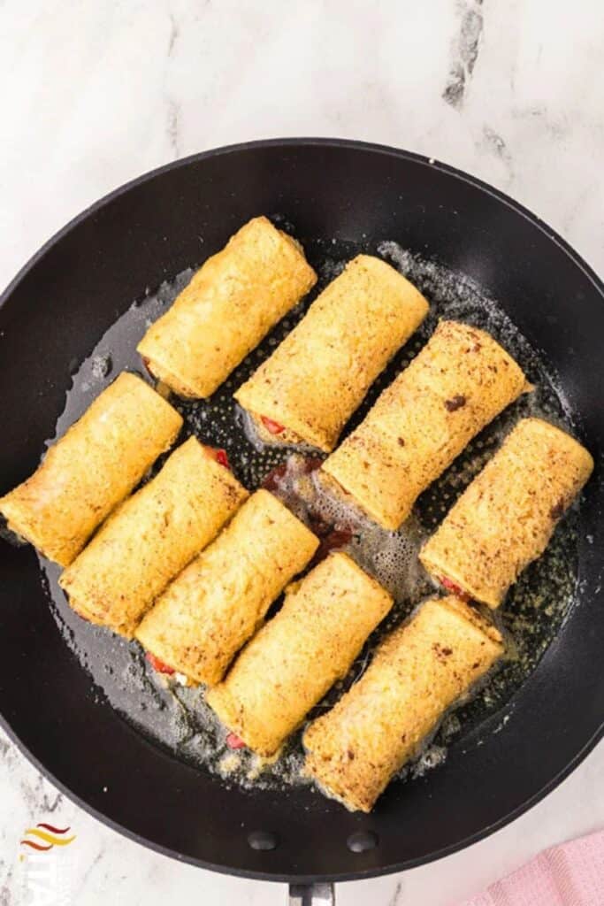 french toast rollups in a cast iron pan